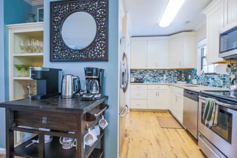 There is a coffee bar situated in between the kitchen and dining room.