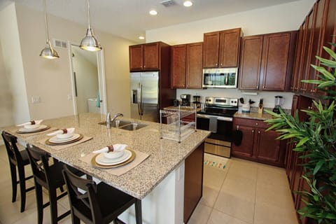 Modern Kitchen w/Stainless Steel Appliances and Granite Counter Tops