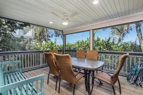 Screened lanai with outdoor dining table