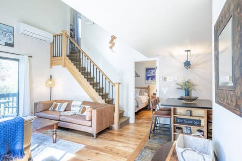 The condo is open concept and the living area is fully furnished with comfortable furnishings, fireplace, hardwood floors and HDTV with satellite TV.