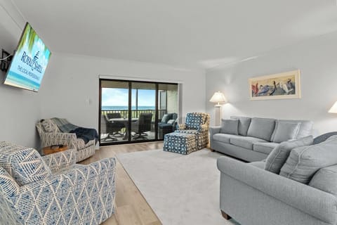 Bright and spacious living area with coastal décor, natural light, and comfortable seating—perfect for relaxing after a day on Sanibel's beaches