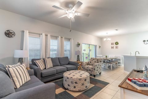 Open living room with access to kitchen, dining room, and private pool!