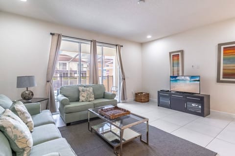 Large living room with pull out couch and access to the private patio and plunge pool