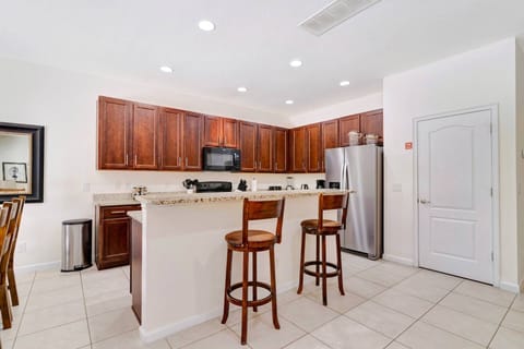 Bright and open kitchen with bar seating