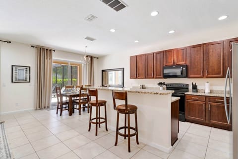 Kitchen and dining open to the living area and the private pool