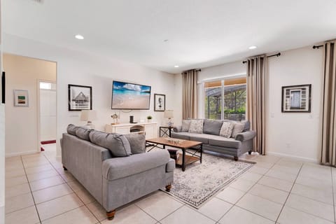 Bright and inviting living room with access to the private pool