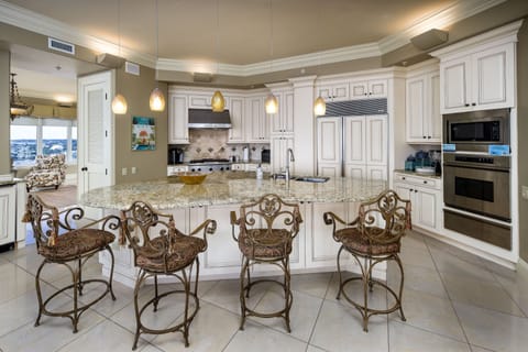 Spaciousness is another amenity throughout this Penthouse - Refrigerator hidden with custom cabinetry