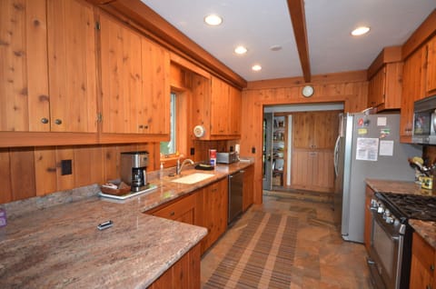 Full kitchen with plenty of counter space to prepare meals. Coffee maker, Dishes & Utensils, Dishwasher, Microwave, Oven, Refrigerator, Stove, Toaster
