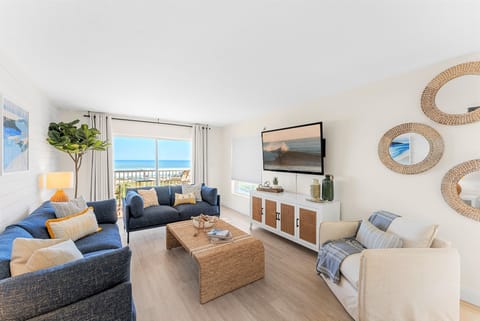 Unwind in a spacious, light-filled living room designed for relaxation.