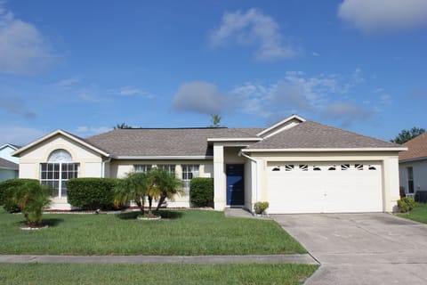Front of this 3 bedroom, 2 bathroom pool home with 2 car garage