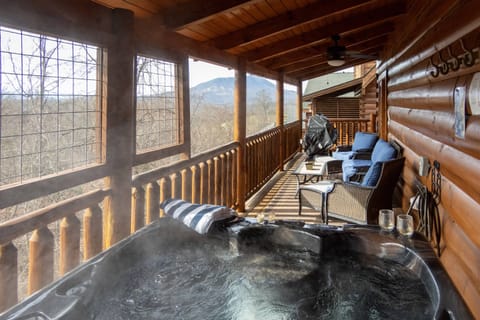 Relax in the covered hot tub while you enjoy the views of Bluff Mountain!