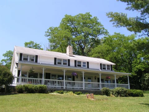 Covered porch for everyone to gather & enjoy yard 
games.