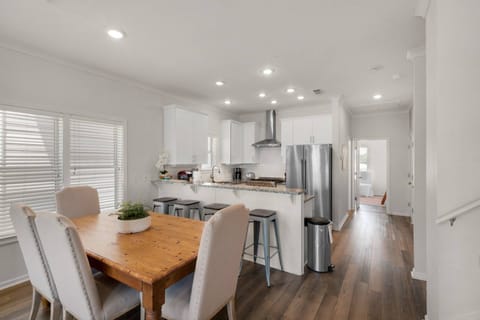 There is a dining room table for 7-8 plus room for 4 additional at the breakfast bar