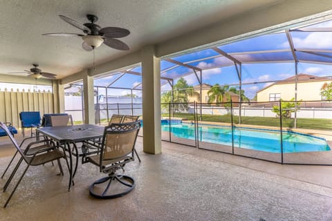 Backyard oasis with dining seating, lounge seating fenced pool and a yard with privacy fence!
