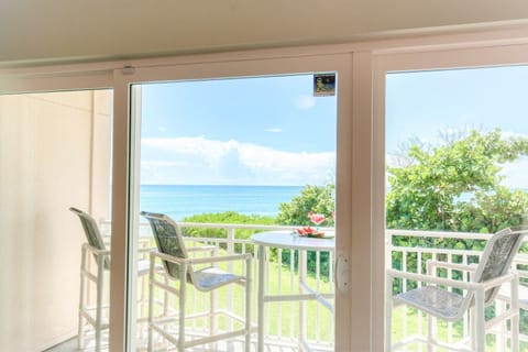 Sliding glass doors lead to outdoor balcony