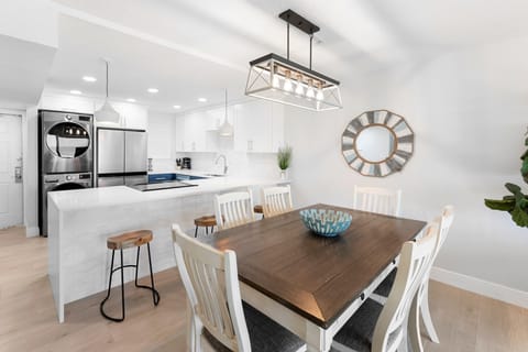 Beautiful dining space featuring a rustic wooden table with seats six