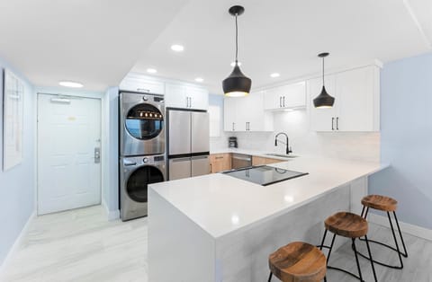 Breakfast bar seats three with in-unit washer & dryer