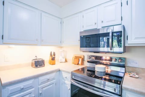 There is also a toaster, blender, coffee maker and tea kettle.