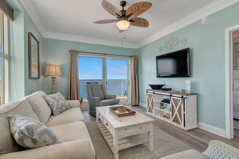 Living area with sofa sleeper, large flat screened TV and DVD player - the balcony provides a beautiful Gulf front view!