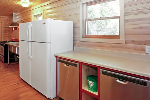 Two dishwashers and two refrigerators in the kitchen