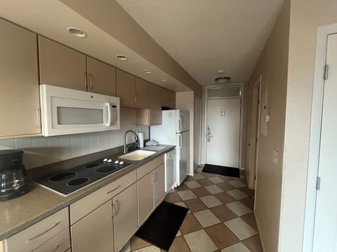 Kitchenette with stove top, mini dishwasher, and microwave. - Kitchenette with stove top, mini dishwasher, and microwave.