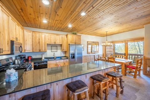 The large breakfast bar has plenty of seating and enough counter space for everyone to dine comfortably. This home is one of the best locations in Par