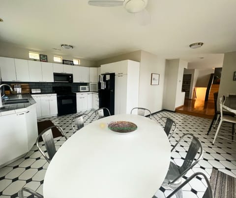 Kitchen and dining area with access to back deck. - Kitchen and dining area with access to back deck.