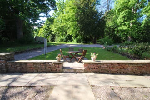 The Studio patio and garden leading into woodlands