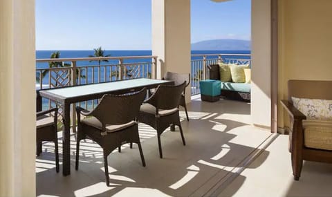 Huge balcony with dining table and a chaise