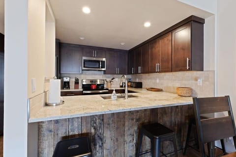 Beautifully remodeled kitchen including island seating