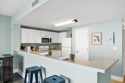 Fully Stocked Kitchen with Bar Seating