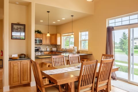 The dining room table seats six and the kitchen bar offers more seating.