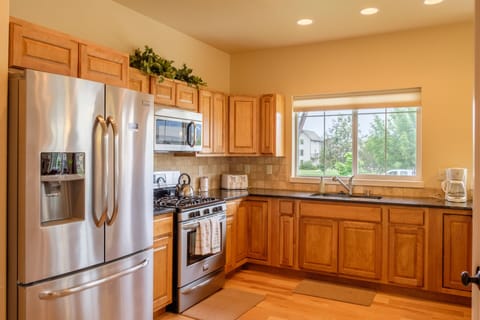 Top of the line stainless steel appliances are throughout this beautiful kitchen.
