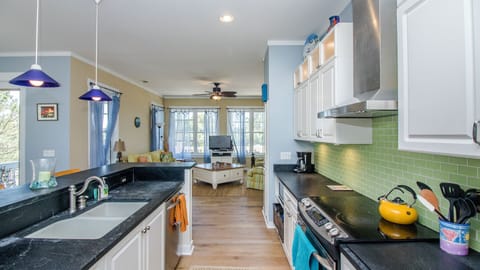 Kitchen, dining room and living room all flow together to make for great family time. Entrances to porch both in kitchen and in living room.