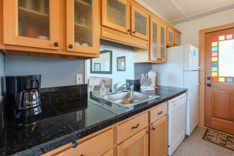 Kitchen has new fir cabinets - Granite counters & new fir cabinets.