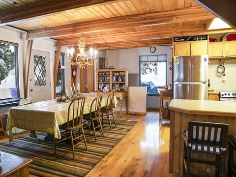 Interior Dining Area and Kitchen - Interior dining area and kitchen, showing door to exterior.