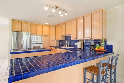 Kitchen has peninsula for maximize space and efficiency