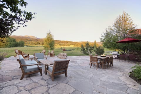 Unwind on your private stone patio with breathtaking mountain views stretching endlessly before you. Gather around the fire pit as golden hour light bathes the rolling hills.