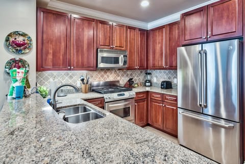 Adagio G105 custom kitchen - Enjoy a well stocked kitchen with upgraded granite counter tops, a NEW GE Refrigerator with French doors, pull out free and internal water dispenser.
Making meals for the whole family will be a breeze with plenty of cookware, serving platters and FiestaWare dishes and silverware. The owner supplies coffee filters and spices as an added amenity.