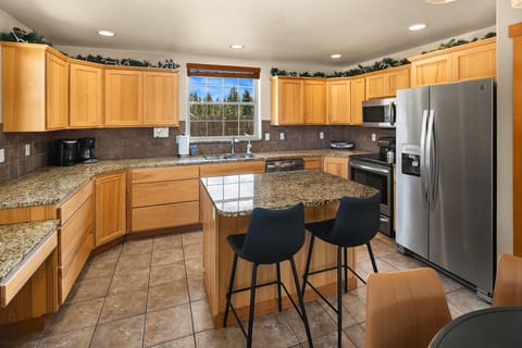 Evergreen Lodge. - Fully stocked kitchen with stainless appliances and granite countertops.