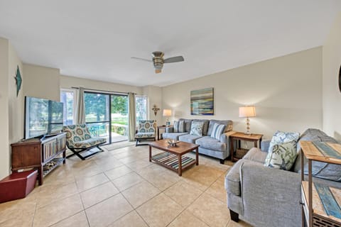 Open Concept Living and Dining Room Overlooking An Incredible View of The Golf Course and Bay