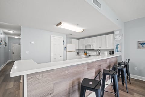 Fully Stocked Kitchen with Bar Seating