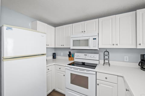 Fully Stocked Kitchen with Bar Seating