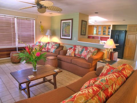 Tiled floors and an open floor plan blend the living, kitchen and dining areas.