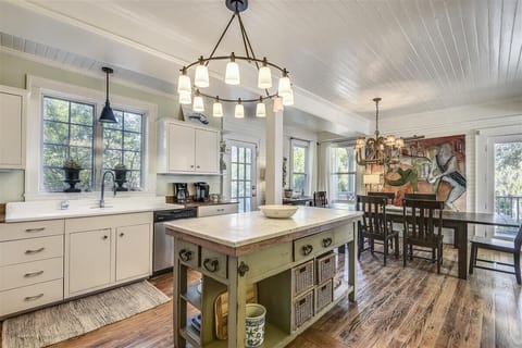 Kitchen and dining areas - The main level kitchen opens into the home's large dining area. Perfect place for group meal and game nights.