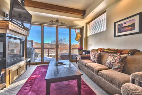 Living Room with Comfortable Furnishings, including a Queen Sleeper Sofa, TV/DVD, Gas Fireplace, and Private Deck with Amazing Views