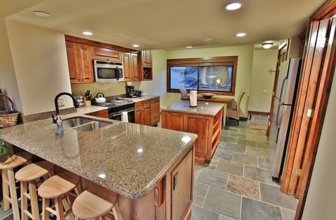 Kitchen with stainless steel appliances and granite counter tops in Park City Racquet Club Village - Park City