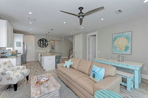 Open concept living from the living, dining and kitchen area