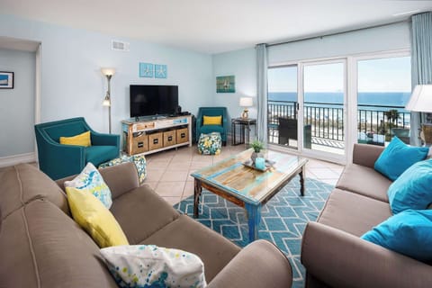 Living room with glass sliders and beach views