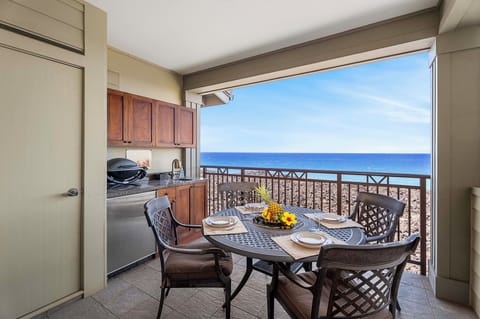 The lanai bar area of this Waikoloa Hawai'i vacation rental with seating and outdoor sink and fridge.